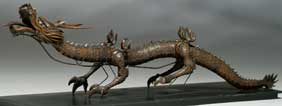 Appraisal: ARTICULATED WOOD DRAGON Meticulously carved antique Japanese wood model of