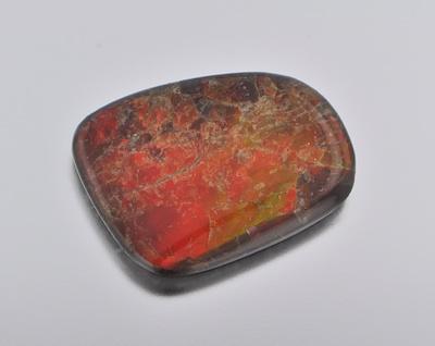 Appraisal: An Unmounted Opal or Ammolite Triplet An unmounted triplet with