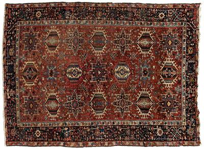 Appraisal: Karaja rug repeating hook-bordered medallions on brick red field ft