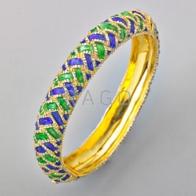 Appraisal: ENAMELED K GOLD HINGED BANGLE Embossed basket woven design with