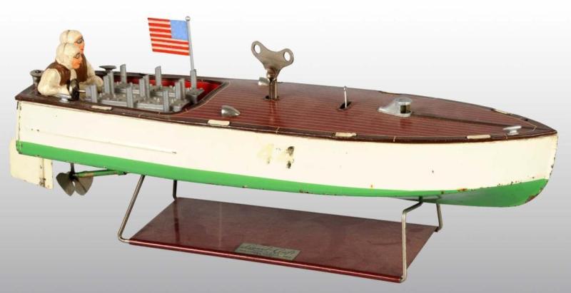 Appraisal: Lionel No Clockwork Speedboat Toy Description Original figures and stand