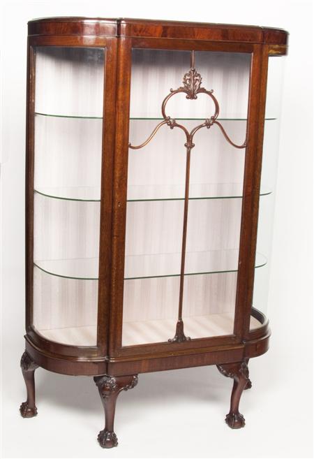 Appraisal: An Edwardian mahogany bowfront display cabinet the moulded top over