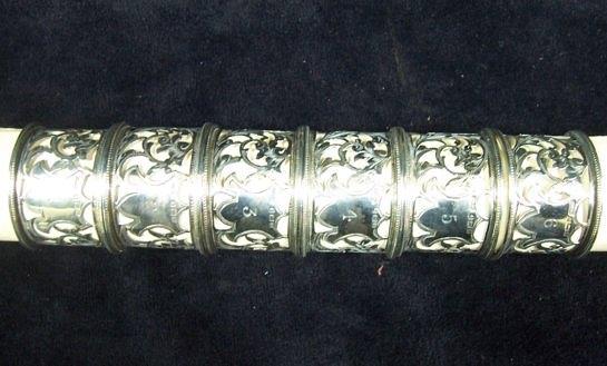 Appraisal: A set of six numbered napkin rings with pierced scrolling