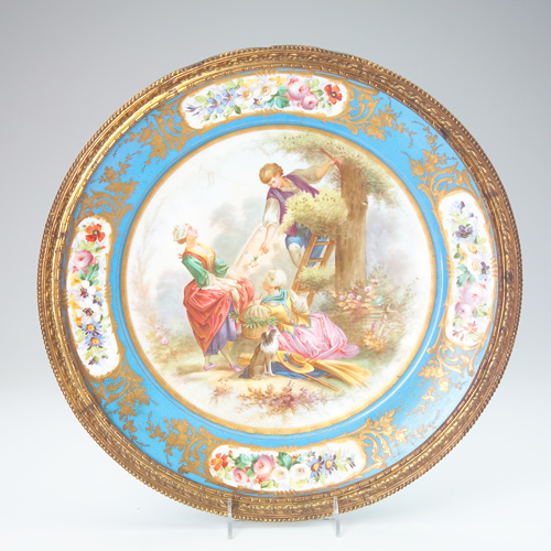 Appraisal: Pair of Sevres-style display plates each painted with a scene