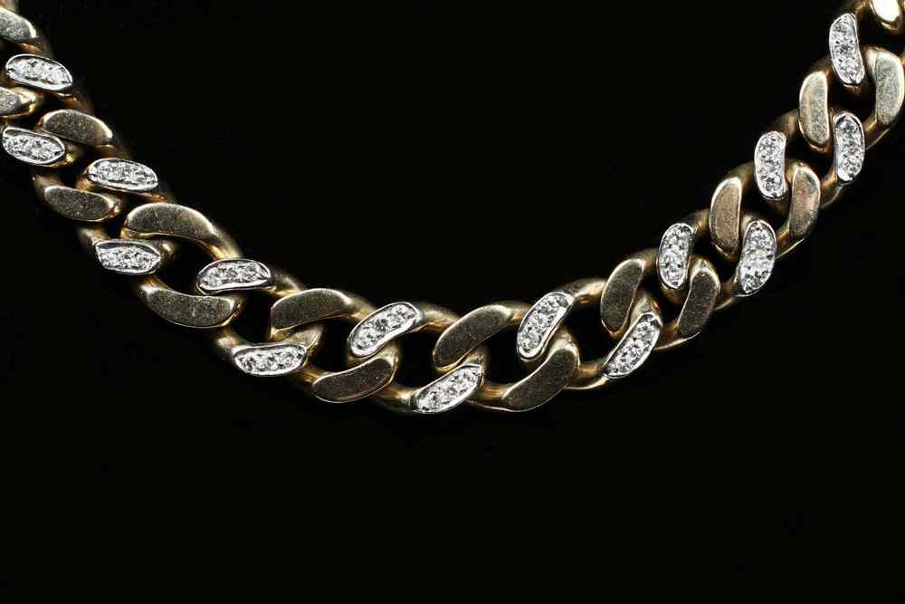 Appraisal: NECKLACE - One K yellow and white gold graduated curb