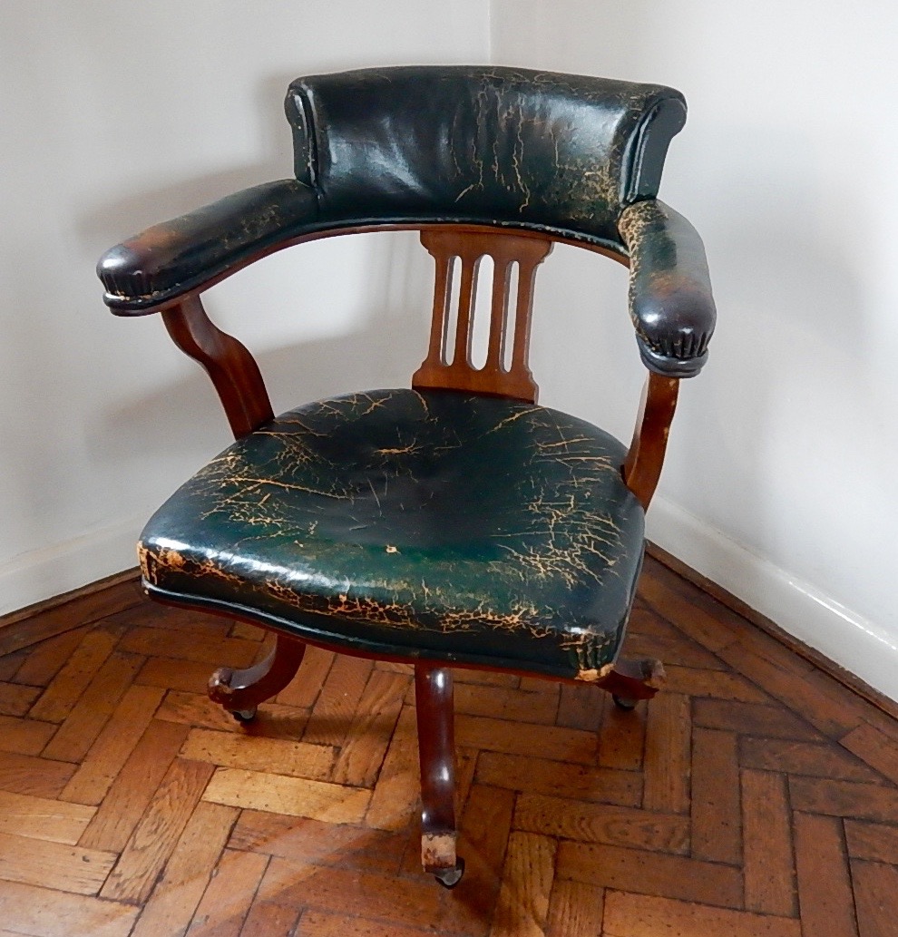 Appraisal: An early thC mahogany swivel chair upholstered in green hide