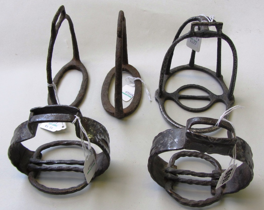 Appraisal: Two pairs of medieval horse stirrups and one single stirrup