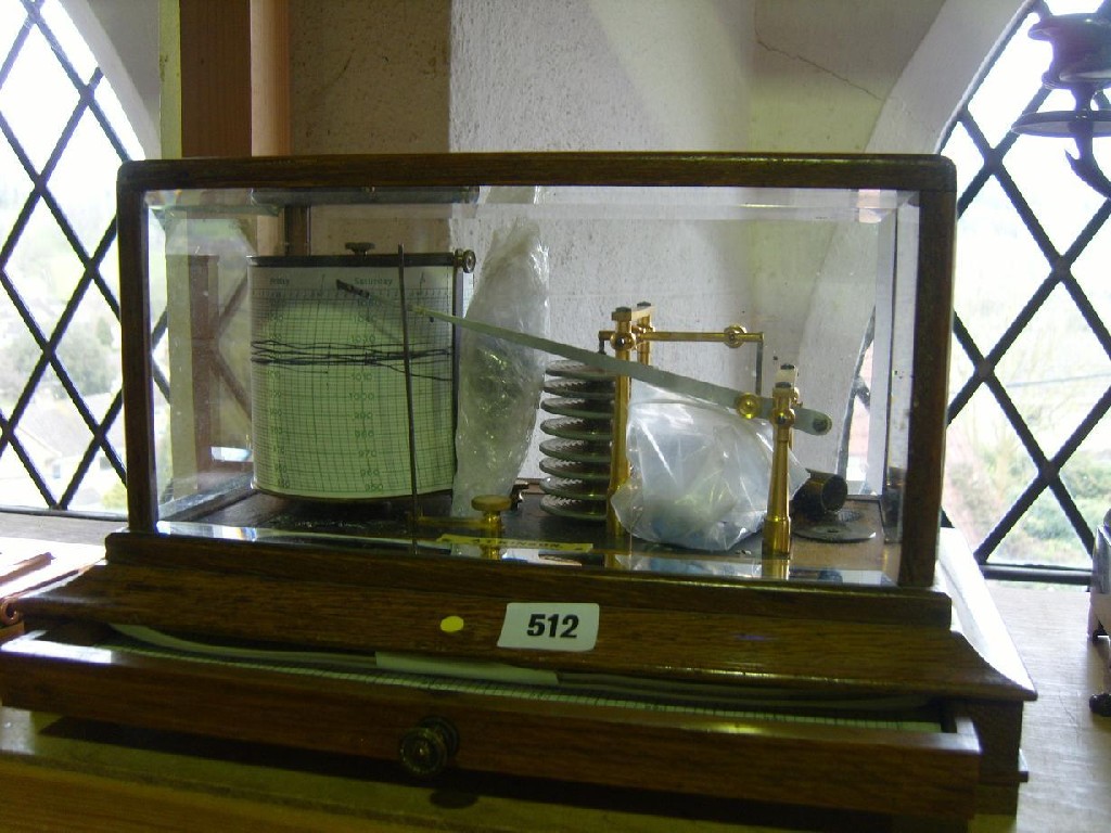 Appraisal: An oak and glass cased barograph by Atkinson of Lancaster