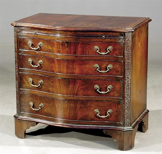 Appraisal: Georgian carved mahogany serpentine bachelor's chest mid th centuryshaped top