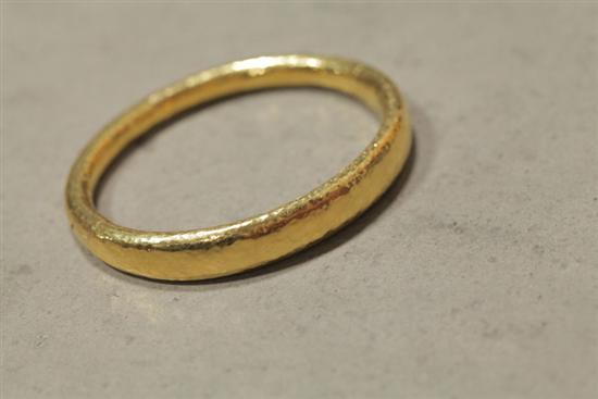 Appraisal: GOLD HAMMERED BANGLE BRACELET Marked ''N K '' '' inside