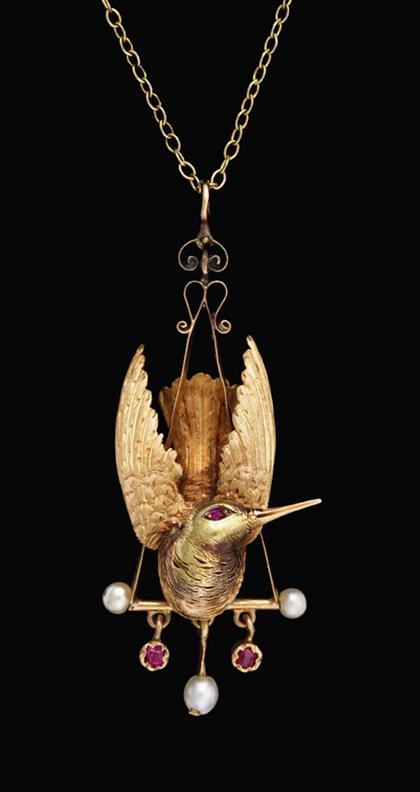 Appraisal: karat yellow gold falling bird pendant With petite rubies and