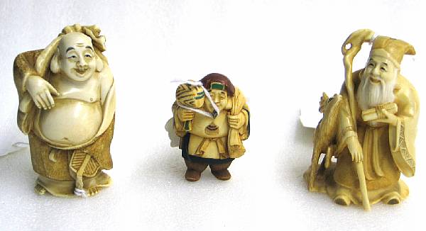 Appraisal: Three small tinted ivory okimono of 'lucky gods' Including figures