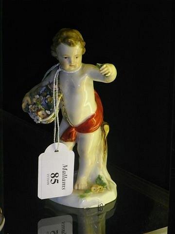 Appraisal: A MEISSEN PORCELAIN FIGURE of a putto holding a basket