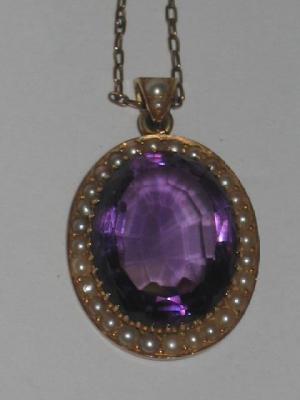 Appraisal: A VICTORIAN AMETHYST AND SEED PEARL PENDANT the oval cut