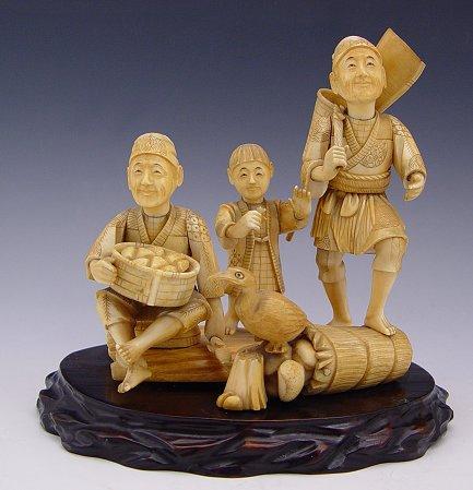 Appraisal: JAPANESE CARVED IVORY FIGURAL GROUP Figures of man with shovel