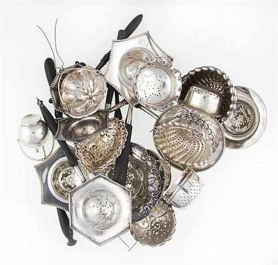 Appraisal: American sterling tea strainers and balls strainers with ebonized handles