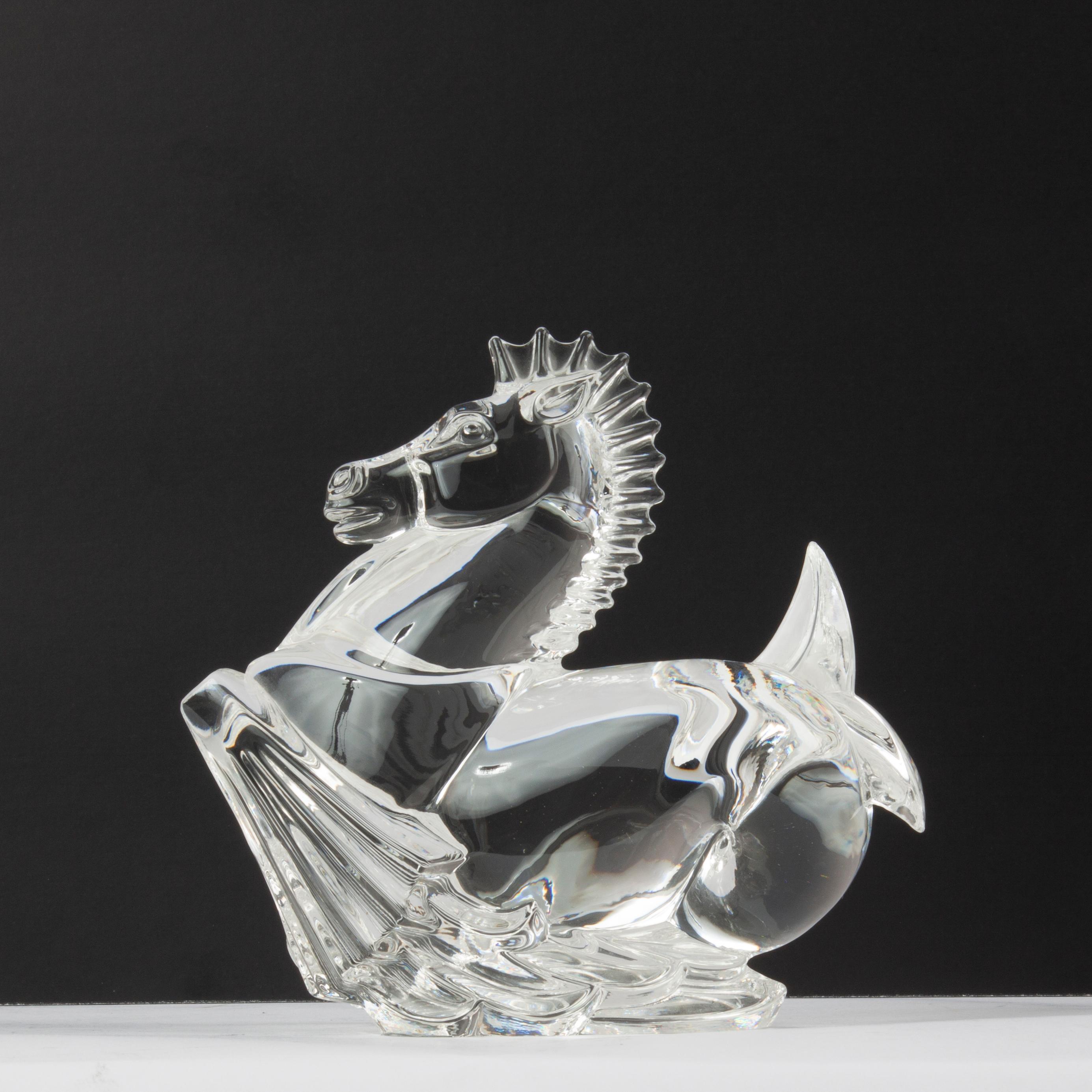 Appraisal: STEUBEN CRYSTAL WINGED SEAHORSE A Steuben crystal winged hippocampus sculpture