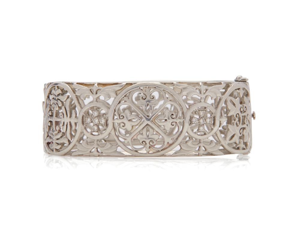 Appraisal: Platinum and Diamond Bracelet the hinged bangle bracelet of open-work