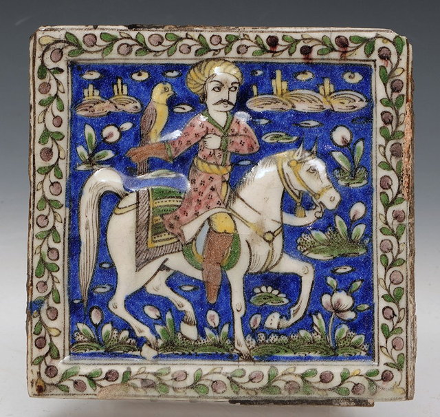 Appraisal: A QAJAR SQUARE TILE with equestrian figure holding a falcon