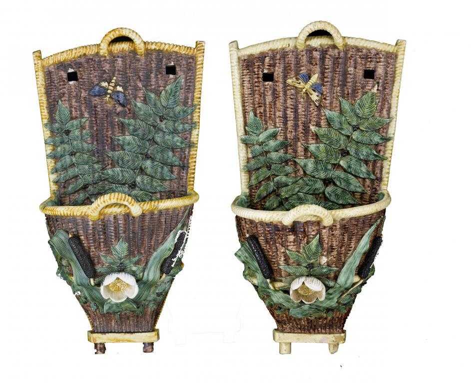 Appraisal: TWO FRENCH MAJOLICA WALL POCKETS in the form of panniers