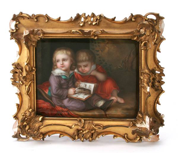 Appraisal: A German porcelain plaque depicting two children reading framed dimensions