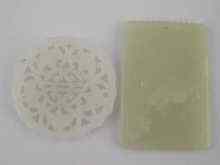 Appraisal: Two jade pendants each carved in relief x cm and