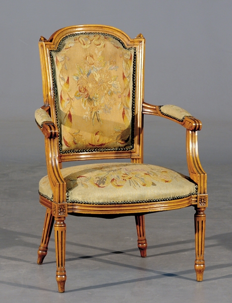 Appraisal: Louis XVI style carved fruitwood fauteuil circa arched back and