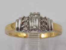 Appraisal: An carat gold baguette diamond ring with diamond set shoulders