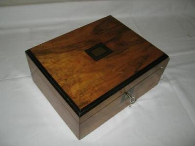 Appraisal: A WALNUT SEWING BOX of oblong form with string inlay