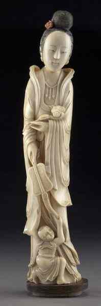 Appraisal: Chinese Qing carved ivory lady and boy International buyers should