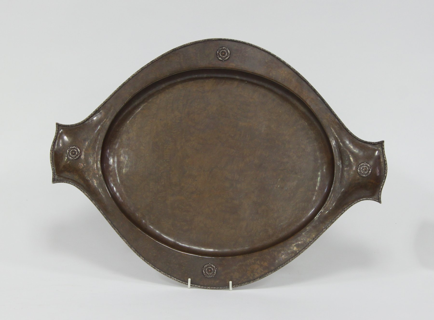 Appraisal: A copper tray by A E Jones cm wide