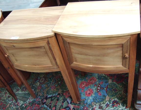 Appraisal: A pair of th century hardwood bow front bedside tables