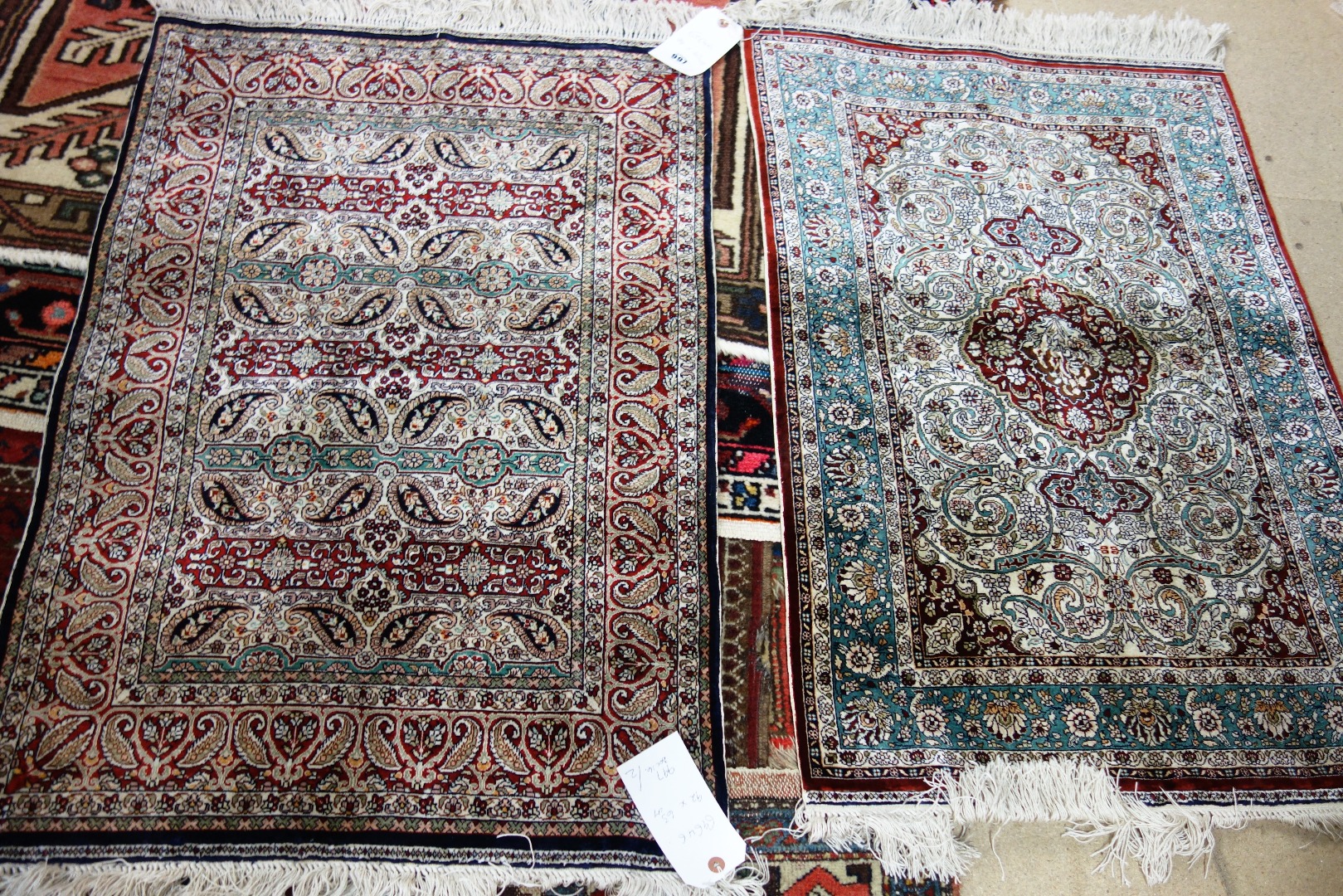 Appraisal: A Keyseri silk rug Turkish the ivory field with a