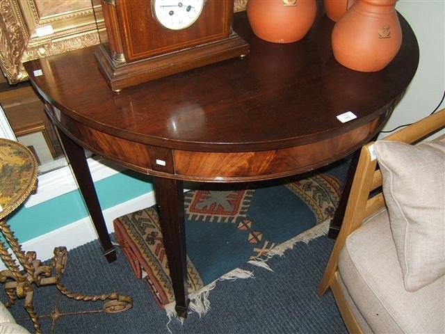 Appraisal: A mahogany 'D' shaped side table by Waring Gillow standing