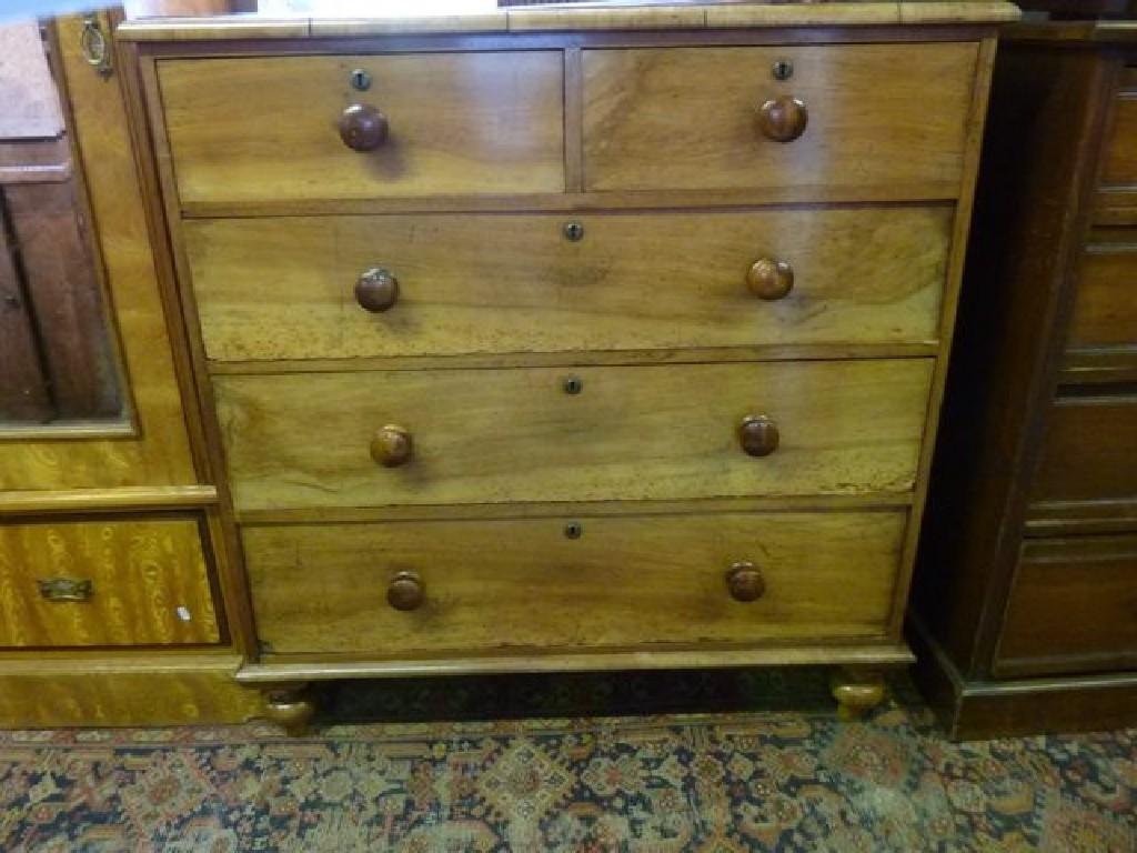 Appraisal: A th century mahogany chest fitted with three long and