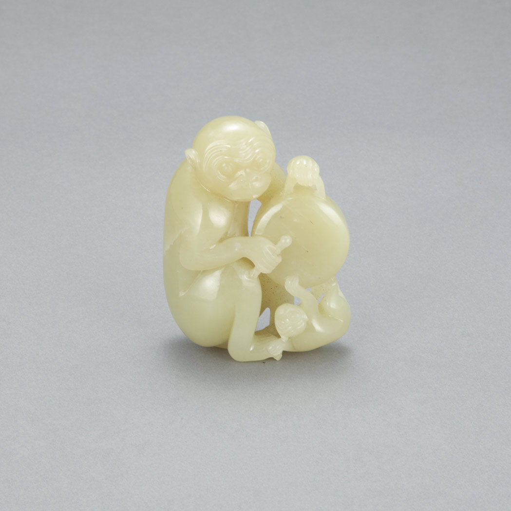 Appraisal: Chinese Yellow Jade Monkey Group Qing Dynasty The seated monkey