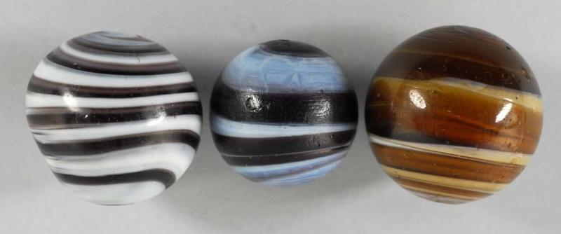 Appraisal: Lot of Horizontal Swirl Marbles Description One has large chip