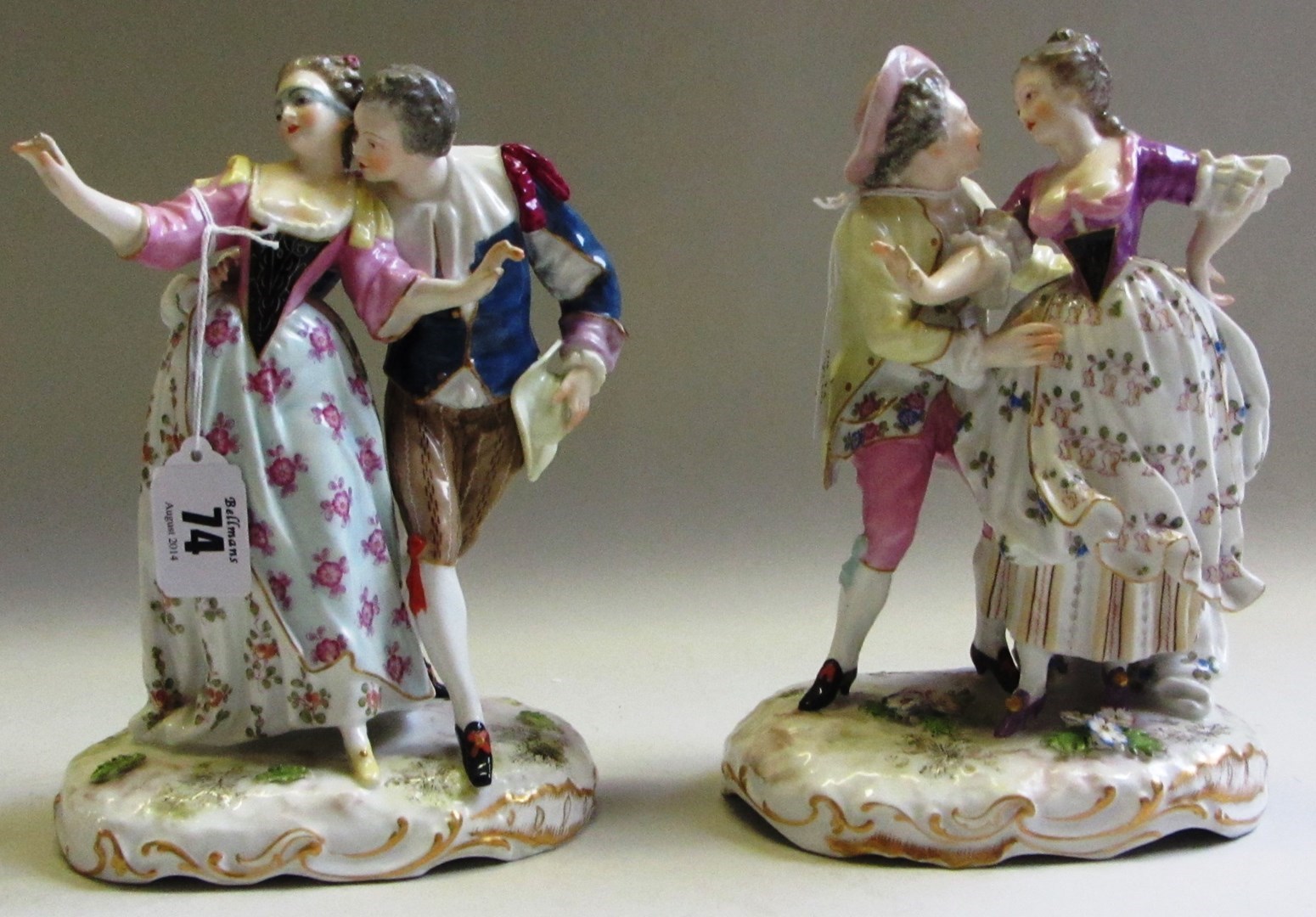 Appraisal: A pair of Continental porcealin figure groups late th early