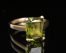 Appraisal: Ladies' Gold Ring With A Yellow-Green Gemstone A k yellow