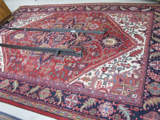 Appraisal: HAND KNOTTED ORIENTAL CARPET Indo-Heriz central geometric medallion and overall