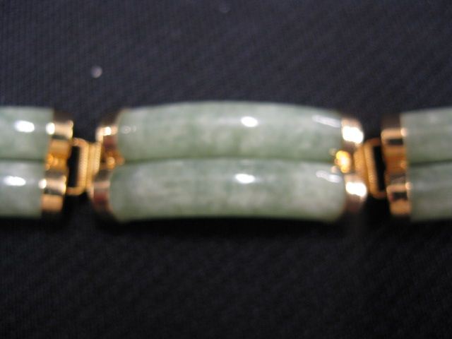 Appraisal: k Gold Jade Bracelet double row cylinderical curves yellow gold