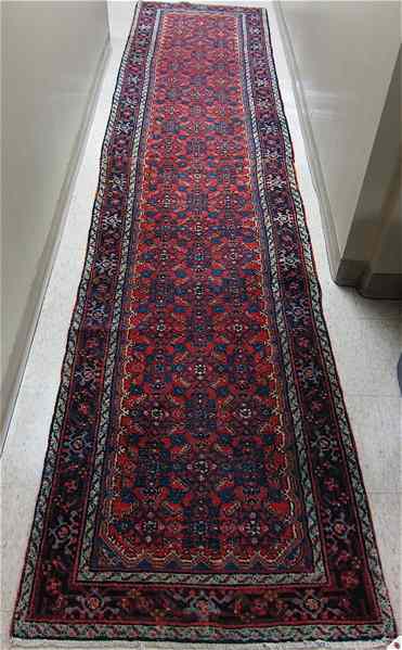 Appraisal: SEMI-ANTIQUE PERSIAN RUNNER hand knotted in an overall Herati floral