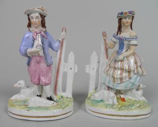 Appraisal: Pair of Staffordshire figurines Pair of Staffordshire figurines- Boy and