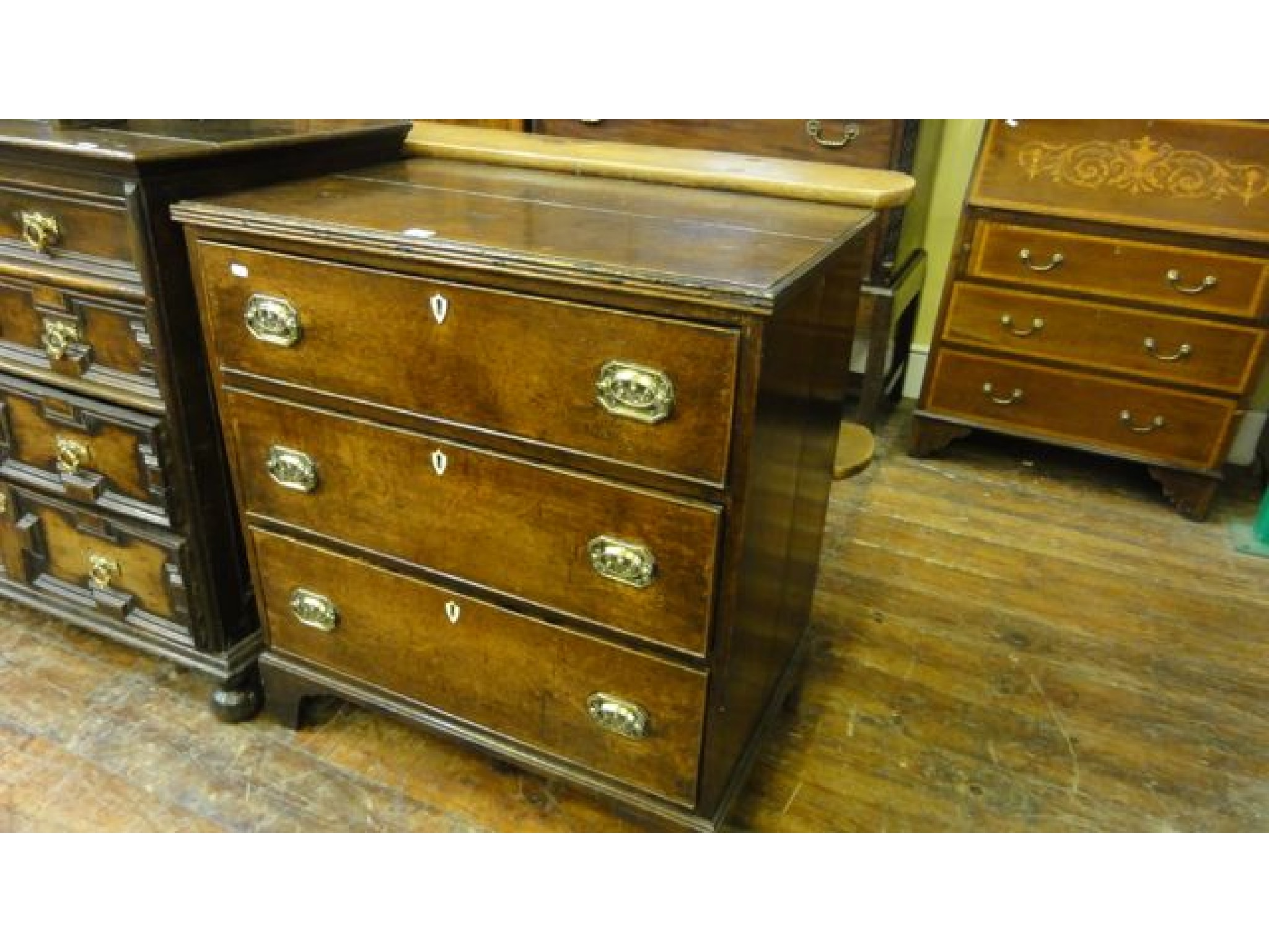 Appraisal: A Georgian oak country made chest of three long drawers