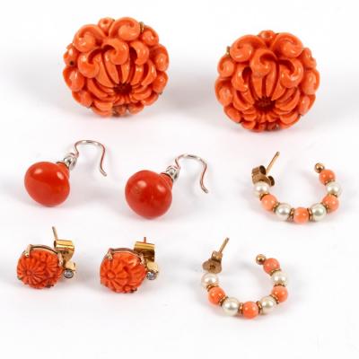 Appraisal: A pair of coral ear clips carved as chrysanthemums and