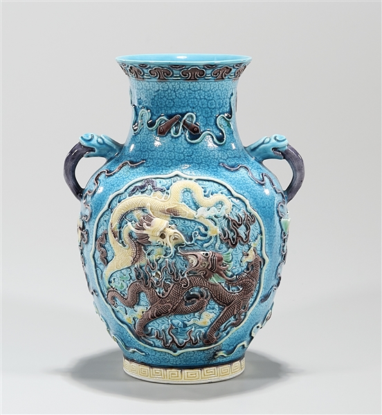 Appraisal: Chinese turquoise glazed porcelain vase with relief dragons chasing pearls