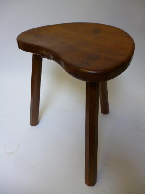 Appraisal: AN ADZED OAK STOOL by Robert Mouseman Thompson of kidney