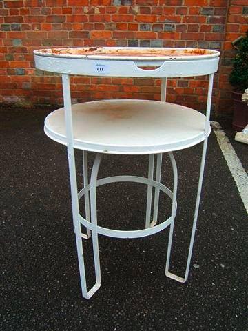 Appraisal: A white painted metal conservatory stand with circular top and