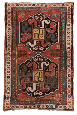 Appraisal: Caucasian Rug early th century two large central medallions with