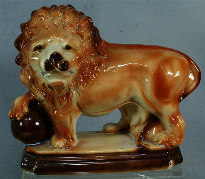 Appraisal: English Staffordshire figure of a lion with glass eyes c